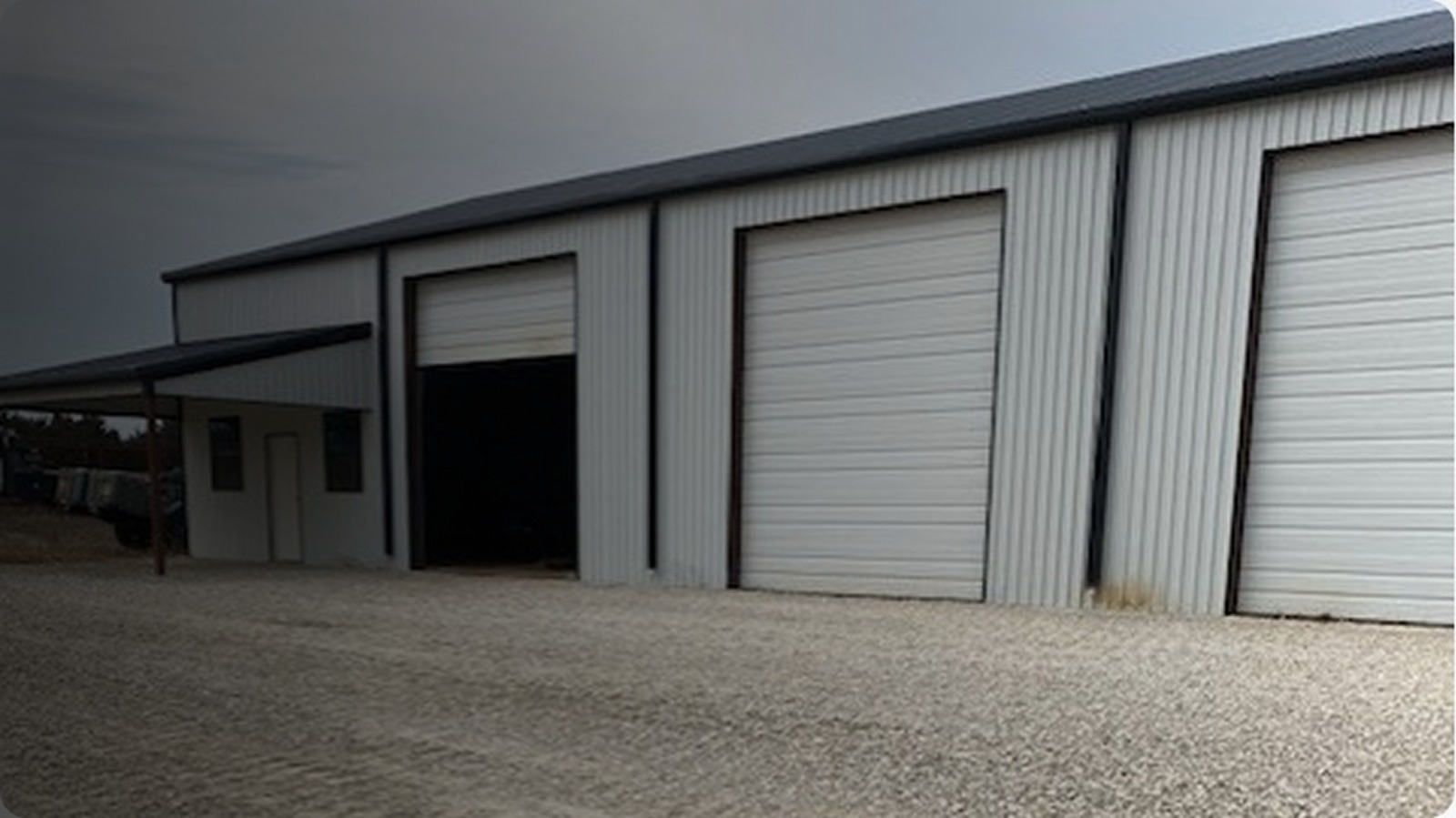 Commercial metal building with overhead shop doors